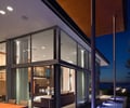 Preview of Graham Residence - Image 10: Furniture, Dining Table, Table, Door, Sliding Door, Folding Door, Outdoor, Water features, Wood ceiling, Structure steel, Glass exterior, Lighting.