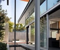 Preview of Graham Residence - Image 9: steel frame, Jar, Plant, Potted Plant, Pottery, Vase, Architecture, Building, Column, Pillar, Outdoor, Water features, Structure steel, Glass exterior, Wood ceiling.