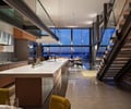 Preview of Graham Residence - Image 18: Banister, Handrail, Staircase, Chair, Furniture, Concrete floor, Lighting.