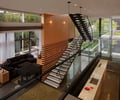 Preview of Graham Residence - Image 20: Couch, Furniture, Banister, Handrail, Staircase, Hardwood, Wood, Bench, Indoor , Wood wall, Concrete floor, Lighting.