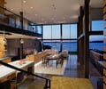 Preview of Graham Residence - Image 21: Great room, Dining Table, Furniture, Table, Dining Room, Indoors, Room, Restaurant, Apartment, Building, Housing, Lighting, Concrete floor, Structure steel, Glass interior.