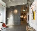 Preview of Grand Image - Image 0: Chair, Furniture, art, concrete floor, exposed duct, meeting space, gallery, rolling door.