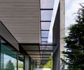 Preview of Highland Residence - Image 16: Patio, Pergola, Porch, Arecaceae, Flora, Palm Tree, Plant, Tree, Abies, Conifer, Fir, Building, Office Building, grating , concrete wall.