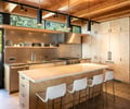 Preview of Vashon Island Cabin - Image 10: kitchen, contemporary, wood beams, modern, pendant lighting, countertops, bar stools, natural light, open shelving, stainless steel appliances, custom cabinetry, sleek design, tile floor, minimalist, functional layout, warm tones, wood finishes, window views.