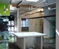 Preview of Ip Resources - Image 1: Track Lighting, Skylight, Concrete, Glass, Meeting Room, Entry, Door, Window, Exposed Structure, systems, glass interior, concrete counter.