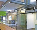 Preview of Ip Resources - Image 4: Wood, Glass, Exposed Duct, Exposed Structure, Track Lighting, Steel, Concrete, Window, Entry, concrete floor, glass interior, desk.