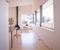 Preview of Kogan Residence - Image 4: Dining Table, Furniture, Table, Flora, Plant, Potted Plant, Flooring, Indoors, Interior Design, Floor, Glass interior, Great room, Dining room, Wood floor, Fireplace, fireplace , wood floor.