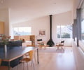 Preview of Kogan Residence - Image 5: Chair, Furniture, Dining Room, Indoors, Interior Design, Room, Dining Table, Table, Flora, Plant, Potted Plant, Pottery, Hardwood, Wood, Window, Wood floor, great room, living room, Lighting, fireplace , wood floor.