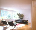 Preview of Lagerberg Residence - Image 6: Couch, Furniture, Chair, Building, Housing, Indoors, Coffee Table, Table, Dining Room, great room , wood floor, bamboo, maple.
