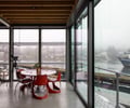 Preview of Lagerberg Mooring - Image 22: urban, waterfront, bridge, modern, contemporary, industrial, steel structure, glass walls, concrete floor, open space, natural light, ceiling beams, deck, minimalist, metal railing, interior design, railing, waterfront.