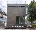 Preview of Lagerberg Mooring - Image 0: bridge, railing, structure concrete, concrete wall, stair, glass windows, modern architecture, steel framework, industrial style, elevated structure.