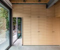 Preview of Lagerberg Mooring - Image 15: glass doors, wood paneling, concrete floor, railing, sliding doors, natural light, interior design, storage, minimalist design, structure wood.