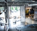 Preview of Light Manufacturing - Image 4: Exposed Structure, Exposed Duct, Structure Steel, Window, Glass, Stair, Staircase, Seating, Chainmail, Steel, Concrete, Curtain.