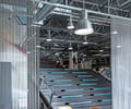 Preview of Light Manufacturing - Image 5: Dining Table, Steel, Concrete, Exposed Structure, Exposed Duct, Chainmail, Stair, Staircase, Seating, Curtain, Structure Steel.