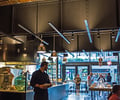 Preview of Mamnoon Restaurant - Image 1: Human, Steel, Exposed Structure, Wood, Concrete, Glass, Window, Glass Door, Sliding Door, Table, Dining, Restaurant, Kitchen, Stainless Steel.