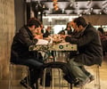 Preview of Mamnoon Restaurant - Image 2: Game, Chair, Cafe, Table, Dining Table, Dining, Steel, Structure Steel, Exposed Structure, Concrete, Restaurant.