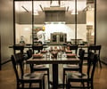Preview of Mamnoon Restaurant - Image 6: Dining Table, Dining Room, Kitchen, Steel, Exposed Structure, Structure Steel, Appliances, Glass, Window, Restaurant.