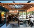 Preview of Mamnoon Street - Image 0: Restaurant, Wood, Glass, Window, Storefront, Concrete, Steel.