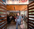 Preview of Mamnoon Street - Image 3: People, Steel , Wood, Concrete, Glass, Entry, Door, Bar, Dining Table.