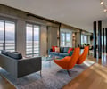 Preview of Market Condo - Image 1: Great room, Couch, Furniture, Indoors, Interior Design, Living Room, Room, wood floor, lighting, waterfront, condo, concrete structure, Carpet, Waterfront, Condominium, Steel, Window, Wood, Concrete.