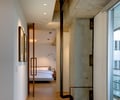 Preview of Market Condo - Image 10: Floor, Housing, Indoors, Furniture, structure concrete, bedroom, wood base, pivot door, reading light, lighting, Hall, Bedroom, Concrete, Pipe, Glass, Condominium, Interior Design.