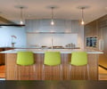 Preview of Market Condo - Image 4: Furniture, Indoors, bar stools, kitchen , pendant lights, cabinets, stainless steel cabinets, kitchen hood, lighting, Interior Design, Kitchen, Wood, Concrete, Stainless Steel, Appliances, Condominium.