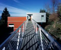 Preview of Mile Post 9 - Image 6: Bridge, Building, Railing, aluminum, entry, wood door, exterior glass, cantilever.