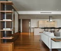 Preview of Millennium Tower Condo - Image 1: Bookcase, Furniture, Hardwood, Wood, Indoors, Interior Design, Coffee Table, Table, wood floor, hood, cabinetry, front door, wood door, air.