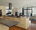 Preview of Millennium Tower Condo - Image 10: Appliance, Electrical Device, Oven, Indoors, Interior Design, Kitchen, Room, Furniture, Dining Table, Table, hood , cabinetry, wood floor, steel hearth, steel surround.