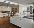 Preview of Millennium Tower Condo - Image 9: Couch, Furniture, Dining Table, Table, Bench, Electronics, Entertainment Center, Fireplace, Hearth, steel cladding, condo.