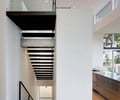 Preview of Open House - Image 12: Banister, Handrail, Indoors, Interior Design, Staircase, open riser, stair, landing, steel handrail, stainless steel, bar pull, concrete floor, recessed base.