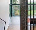 Preview of Open House - Image 15: bar grating, stair infill, structure steel, concrete floor , projector screen, cross bracing.