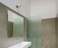 Preview of Open House - Image 3: Sink, Bathroom, Indoors, Interior Design, Room, shower, etched glass, cement plaster, vanity, vanity light.