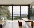 Preview of Open House - Image 9: Dining Table, Furniture, Table, Dining Room, Indoors, Interior Design, Room, Chair, Bench, exterior glass, steel structure, concrete floor, open space.