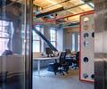 Preview of Payscale - Image 8: Indoors, Office, Desk, Furniture, Table, Steel door, Structure wood, Exposed duct.