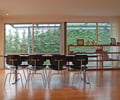 Preview of Petersen Residence - Image 0: Chair, Furniture, Hardwood, Wood, Dining Table, Table, Dining Room, Indoors, Interior Design, Room, wood floor, curtain, glass exterior, bookcase.