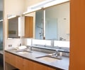 Preview of Petersen Residence - Image 4: Indoors, Interior Design, master bath, stone, cabinet, mirror, vanity, vanity light, medicine cabinet, tab pull.