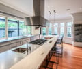 Preview of Victorian Redux - Image 8: Kitchen, Hood, Wood Floor, Stainless Steel, Island, historic.