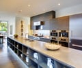Preview of Sawtooth Residence - Image 9: Indoors, Interior Design, Kitchen, Room, Door, Sliding Door, Sitting, Coffee Table, Furniture, Table.