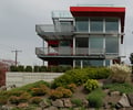 Preview of Shapiro Residence - Image 0: Apartment Building, Building, City, Urban, Plant, Housing, Tree, Glass exterior, roof deck, Condo, Window, Balcony, Concrete wall, grating, color, deck.