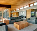 Preview of South Whidbey Residence - Image 12: Furniture, Indoors, Interior Design, Window, Great room, Glass, COncrete, Wood, Daylight, Living room, Sofa, Table, Concrete floor, Interior glass.