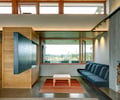 Preview of South Whidbey Residence - Image 13: Furniture, Indoors, Interior Design, Concrete, Glass, Window, Cantilever, Wood ceiling, concrete floor, wood, TV, lighting.