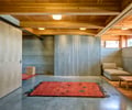 Preview of South Whidbey Residence - Image 18: Carpet, Furniture, Indoors, Sitting Room, Wood, Structure Wood, Sliding Partition, Concrete floor, Sofa, Sliding door.