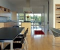 Preview of Stretch House - Image 15: Chair, Furniture, Dining Table, Table, Dining Room, Indoors, Interior Design, Room, Flooring, Meeting Room, wood floor, maple, kitchen, hood.