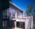 Preview of Stretch House - Image 6: Building, House, Housing, Villa, Patio, Stair, Railing, Chair, Sliding door.
