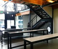 Preview of Tableau - Image 4: Dining Table, Furniture, Table, Chair, Apartment, Building, Housing, Indoors, Loft, Exposed duct, Structure wood, Steel stair, Concrete floor, Lighting.