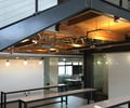 Preview of Tableau - Image 7: Dining Table, Furniture, Table, Lighting, Light Fixture, Indoor, Concrete floor, Structure wood, Exposed duct, Steel stair, Glass interior.
