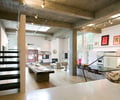 Preview of The Gym - Image 0: Apartment, Loft, Coffee Table, Furniture, Table, Handrail, Staircase, wood floor, terrazzo, rail, structure concrete, stair, steel, skylight, great room, Historic.