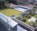 Preview of Tobias Residence - Image 1: Landscape, Outdoors, planter, paver, view, cmu, glass rail.