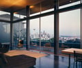Preview of Tobias Residence - Image 12: Bench, Dining Table, Furniture, Table, Chair, Door, Sliding Door, Dining Room, Indoors, Interior Design, Room, Apartment, Building, Housing, wood ceiling, concrete floor, view.